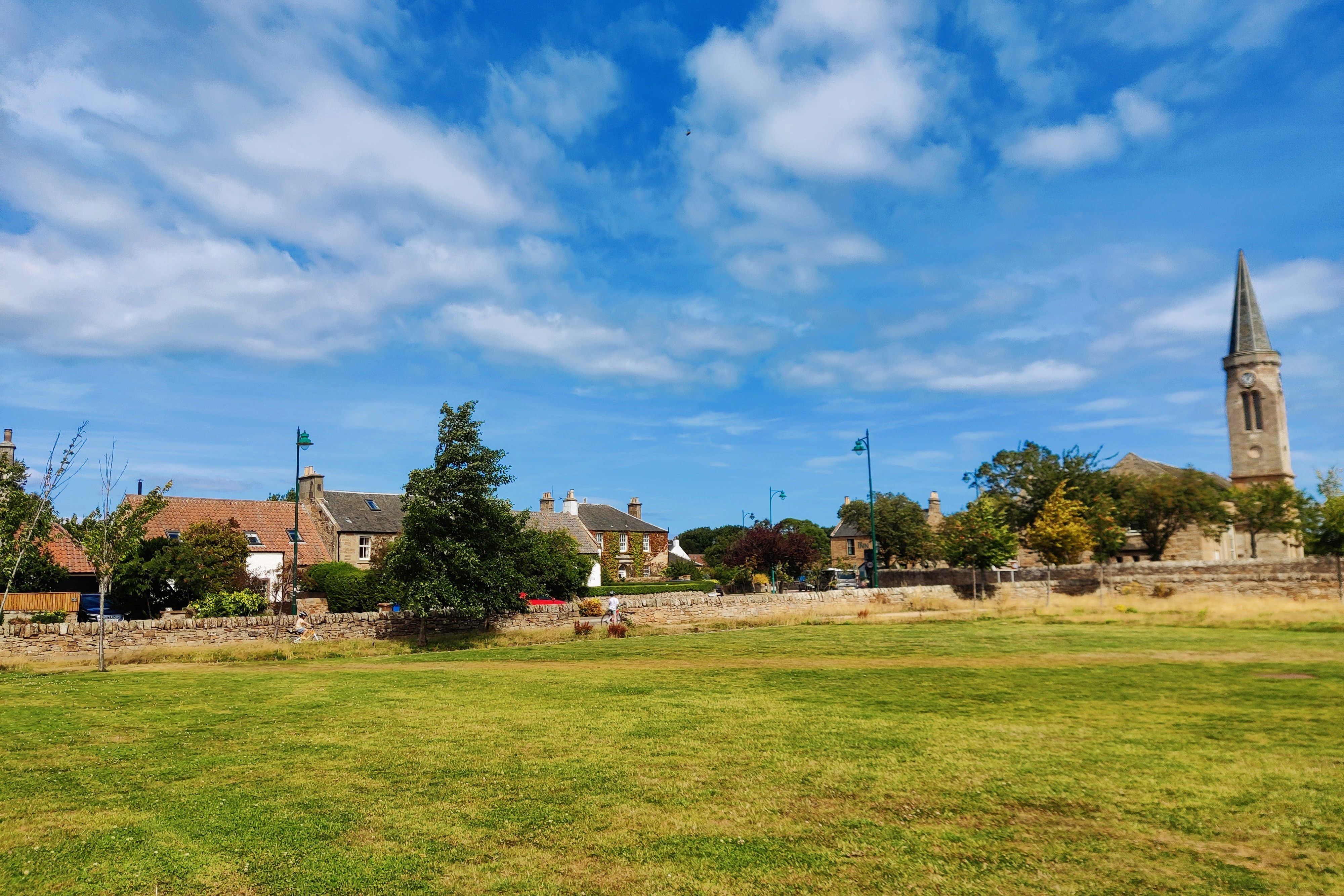 Photo of Kingsbarns village green with Kingsbarns church in the background 